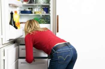 Woman looking in the fridge