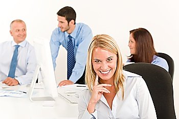 Business team pretty smiling businesswoman portrait happy colleagues around table