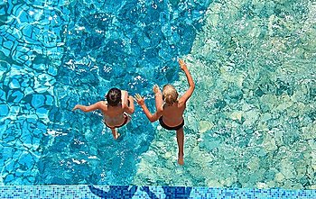 Two children jump in water   top view