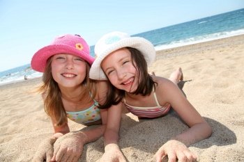 Happy little girls at the beach
