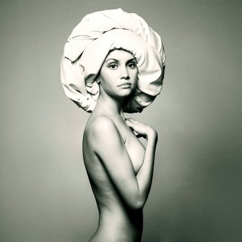 Fashion portrait of nude sensual woman in fashionable turban