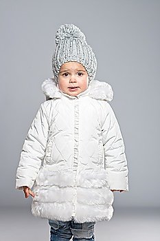 Funny little girl in winter coat
