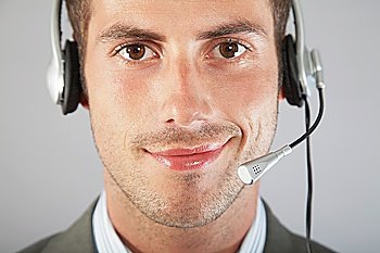 Businessman Wearing Telephone Headset