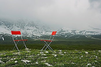 Chairs in Mountain Landscape
