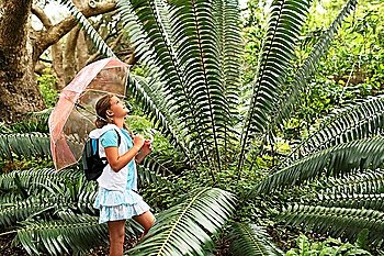 Girl Looking at Large Fern