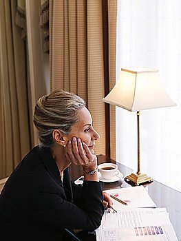 Businesswoman Looking Out of Window