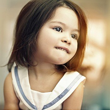 portrait of a beautiful little girl expresses emotions indoor