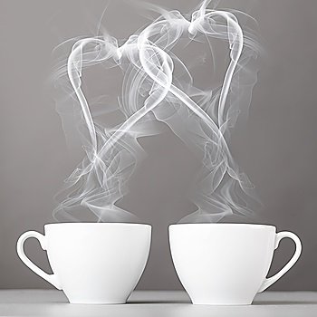 love and coffee heart silhouettes from steaming hot coffee cups
