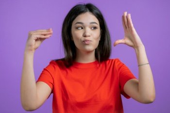 Pretty mixed race woman showing bla-bla-bla gesture with hands isolated on purple background Empty promises  blah concept Lier High quality photo 