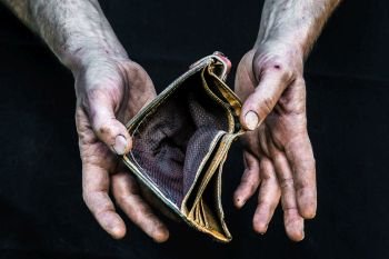 Dirty hands homeless poor man with empty wallet in modern capitalism society