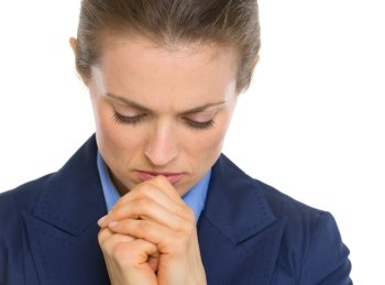 Portrait of praying business woman