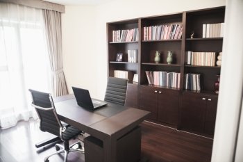 Modern home office with bookshelves