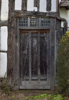 Front entrance doorway to an old Tudor cottage  Warwickshire  England