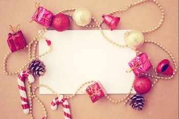 Christmas holiday background with blank greeting card and Christmas decorations  retro filter effect