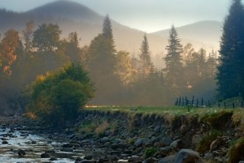 mountain landscape with riverbed in morning light nature