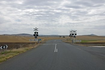 A level crossing on a dull  cloudy day in North-Western Victoria  Australia