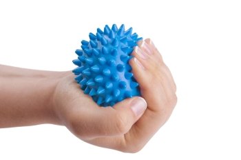 Woman rsquo;s hand with Spiny plastic blue massage ball isolated on white